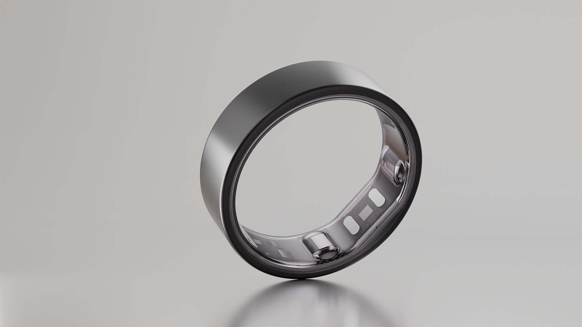 Black Reebok Smart Ring 3D render on reflective glass surface